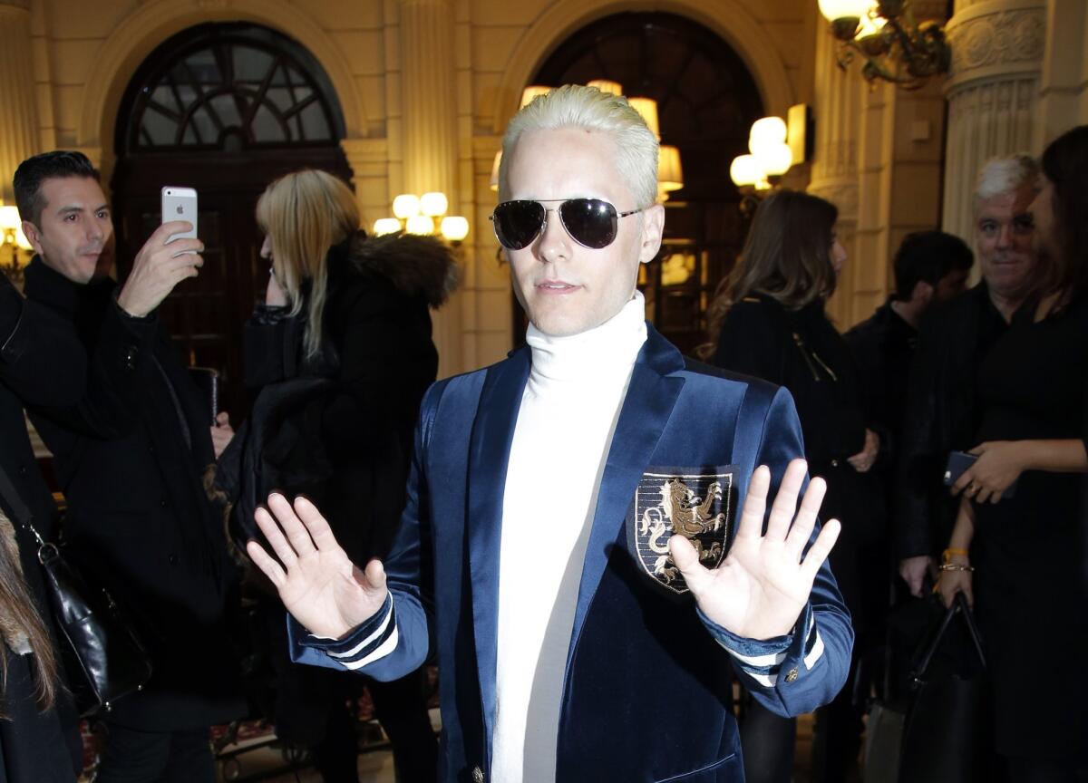 Actor and singer Jared Leto arrives at the Balmain show, blond and sporting shades.