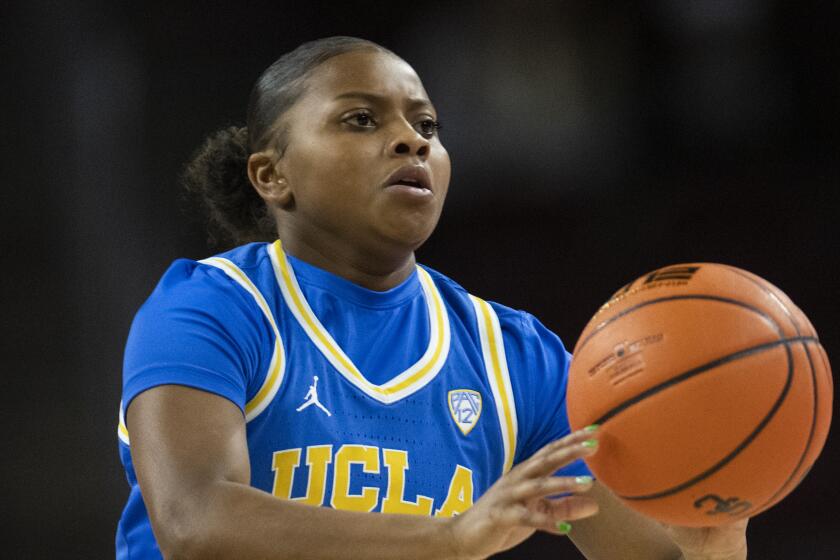 UCLA guard Londynn Jones (3) passes during an NCAA basketball game against Southern California.