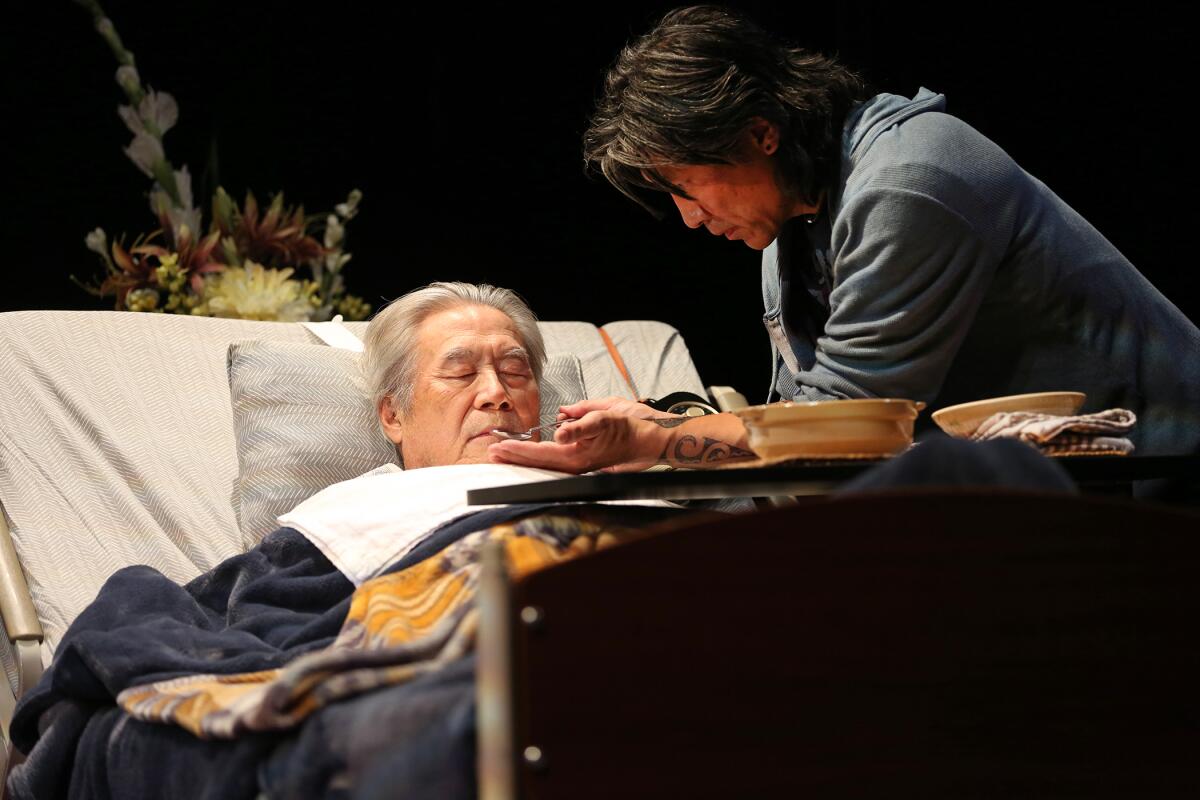 Sab Shimono, left, and Jinn S. Kim in South Coast Repertory's 2019 production of “Aubergine” by Julia Cho.