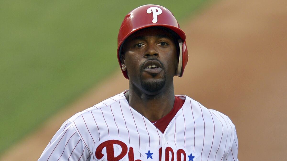 Philadelphia Phillies shortstop Jimmy Rollins scores a run during a game in June 2012.