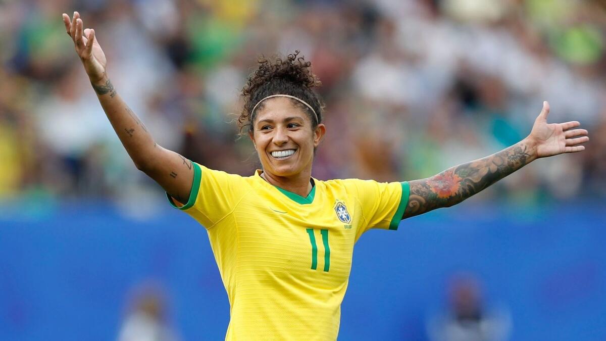 Brazil's Cristiane celebrates after scoring one of her three goals on Sunday.