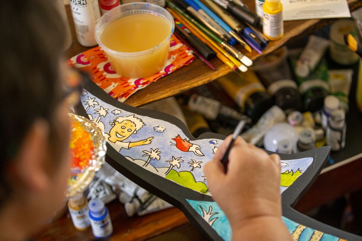 Bonnie Matthews, seen on March 28, 2022, uses a painting method "gouache" to create a vivid yet lightly applied color scheme.