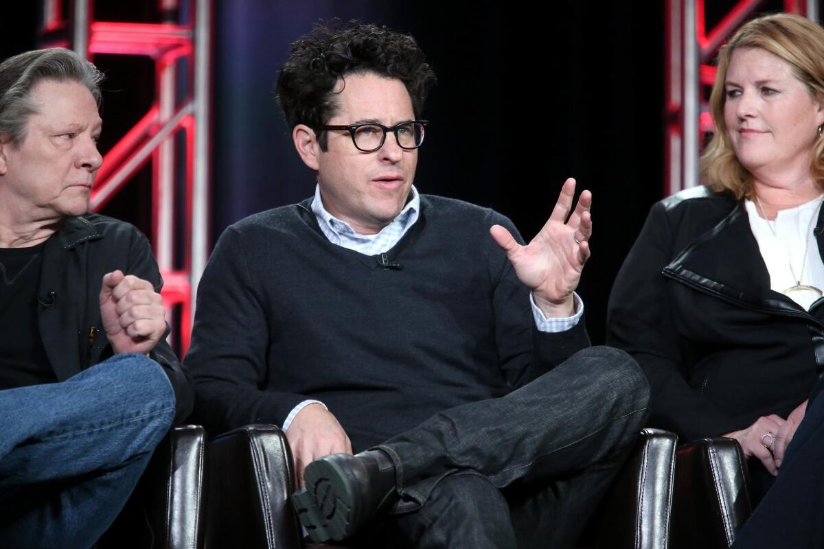 From left, Chris Cooper, J.J. Abrams and Bridget Carpenter speak onstage during the "11.22.63" panel at the 2016 Television Critics Assn. press tour in Pasadena.