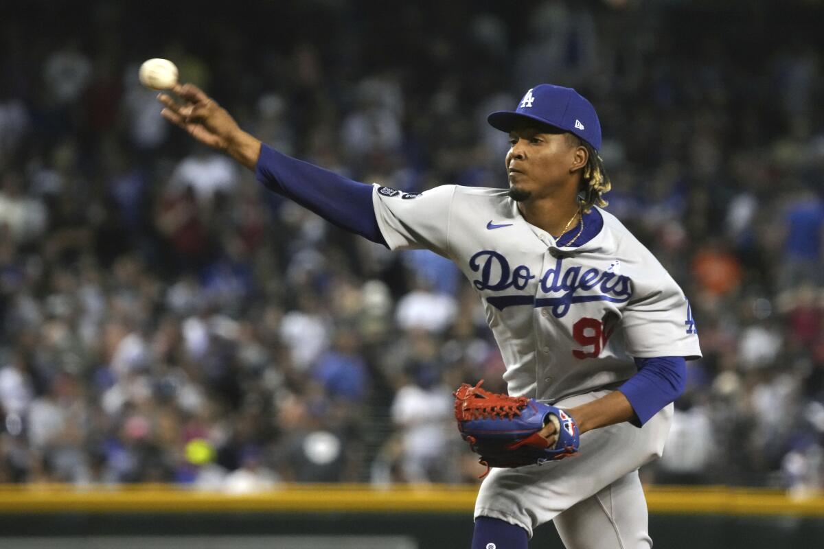 Dodgers reliever Edwin Uceta delivers during the eighth inning in the Dodgers' 9-8 victory Sunday.