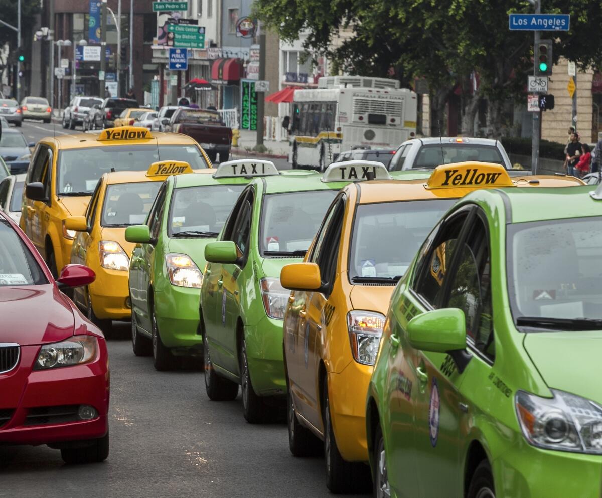 Taxi drivers circle Los Angeles City Hall in their cabs to protest unregulated ride-share services - such as Uber, Lyft and Sidecar - being promoted through smart-phone applications and social media.