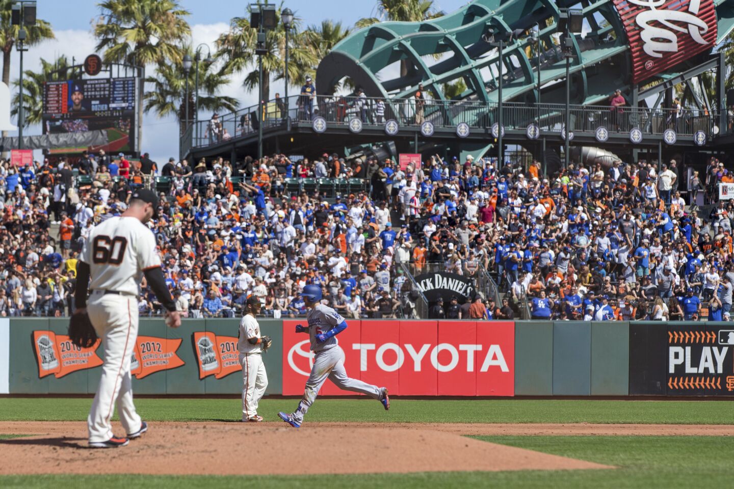 Los Angeles Dodgers Brian Dozier runs the bases after hitting a two-run homer against the San Francisco Giants in the third inning of a baseball game in San Francisco, Sunday, Sept. 30, 2018.