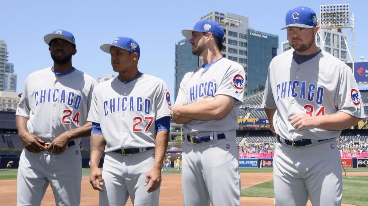 Cubs Dexter Fowler, Addison Russell, Jake Arrieta and Jon Lester (left to right) pose for photos before the 87th Annual MLB All-Star Game.