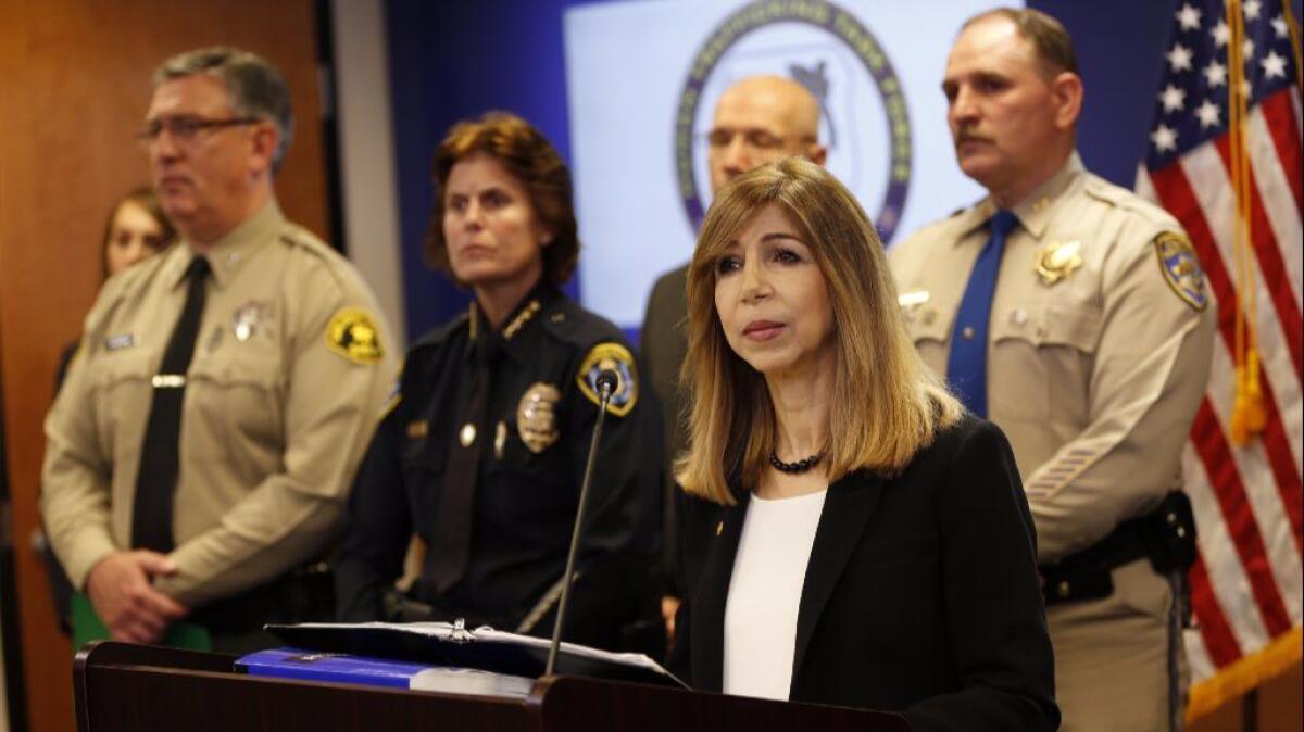 District Attorney Summer Stephan, right, at a news conference.