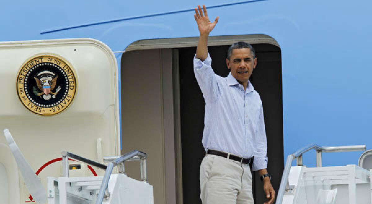 President Obama boards Air Force One in Colorado Springs, Colo., after surveying damage from the Waldo Canyon wildfire.