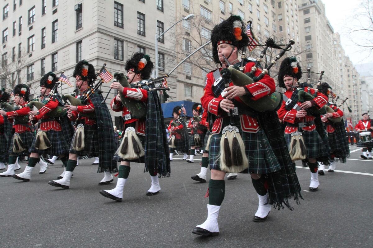 Members of the New York City Fire Department's Emerald Society Pipes and Drums participate in the city's St. Patrick's Day Parade in 2013.