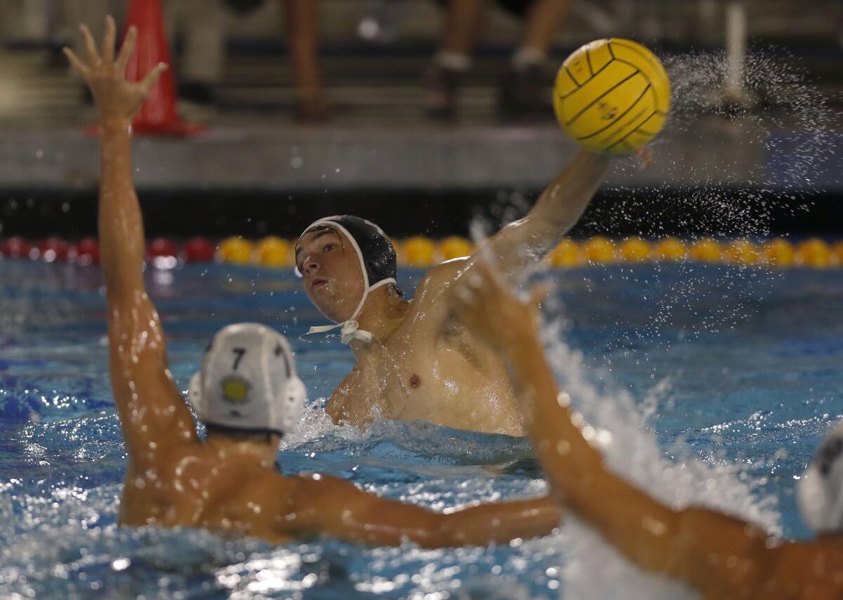 Huntington Beach's Ethan Crooks shoots during the second half of a Surf League match at Newport Harbor on Wednesday.