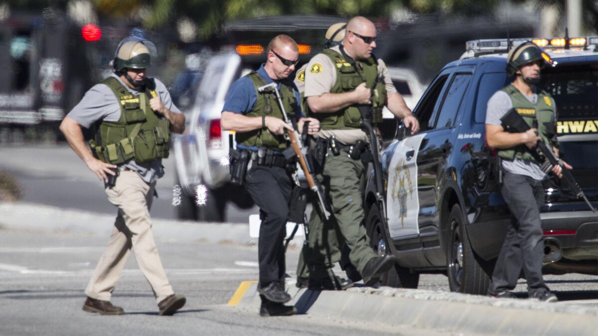 San Bernardino police officers secure the scene at the Inland Regional Center on Wednesday.