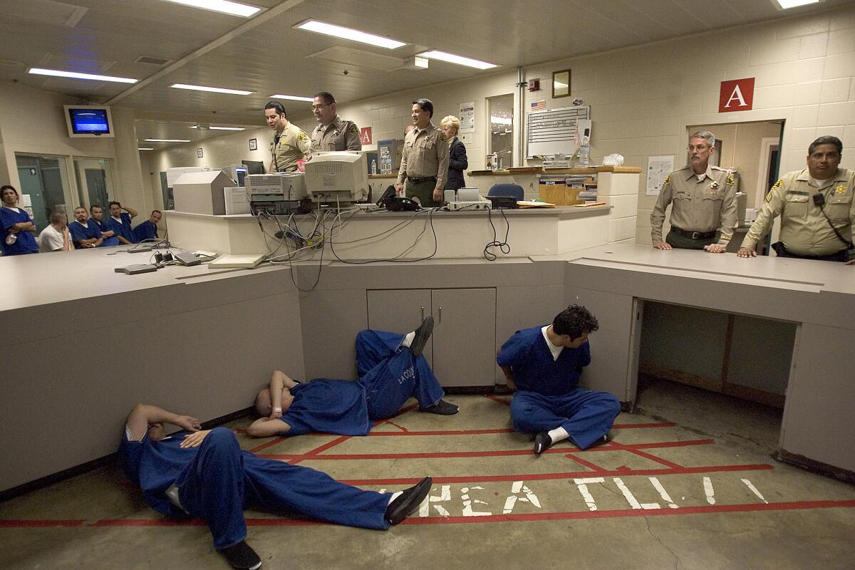 Inmate reception center inmates sleep on the floor.