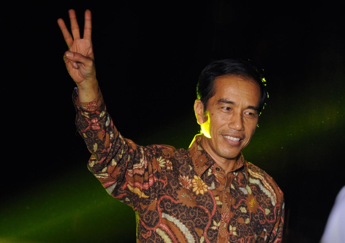 Indonesian presidential candidate Joko Widodo gestures after delivering his victory address.