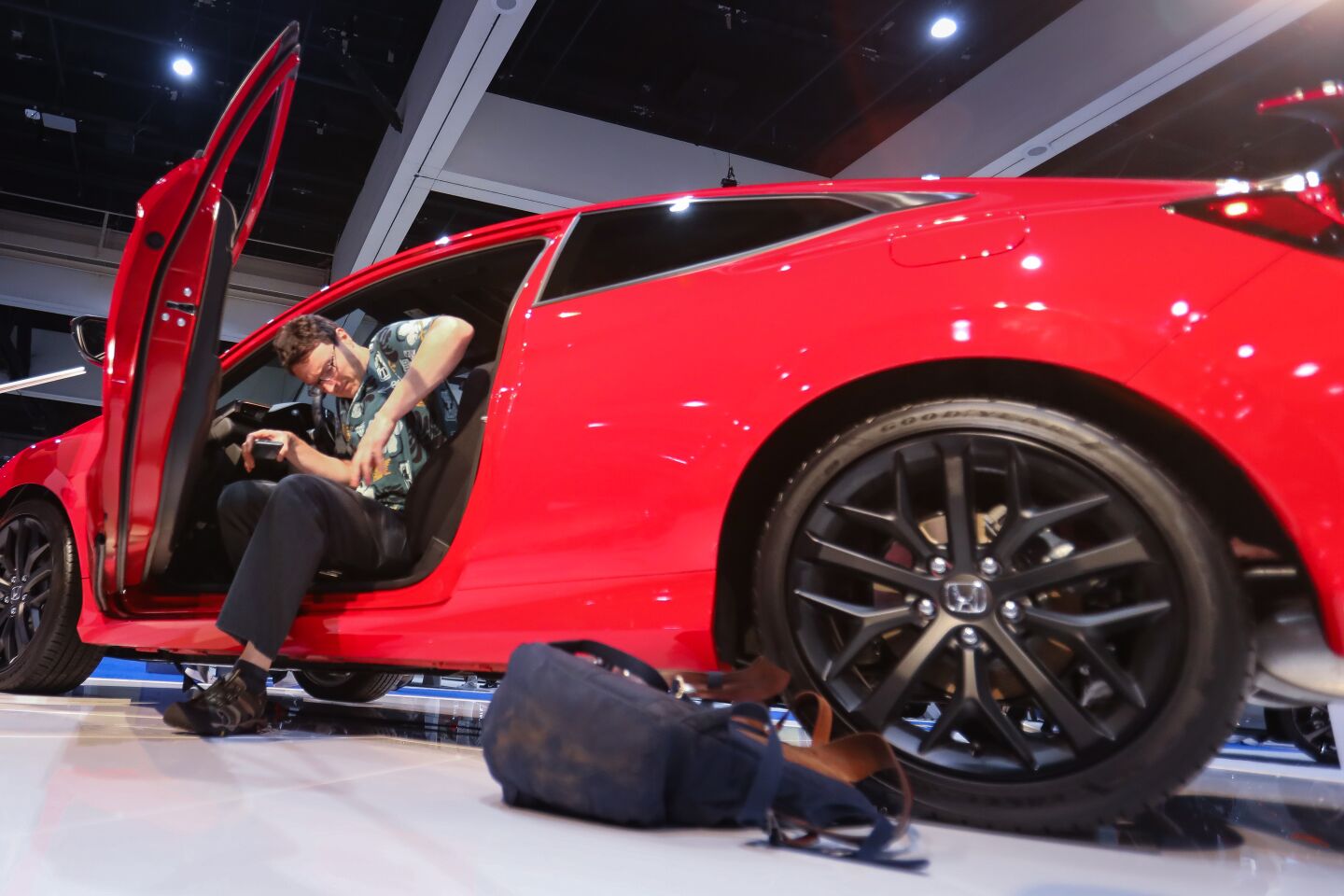 Brian Fisher of Alexandra, Virginia, gets out of a 2020 Honda Civic S1, during the 2020 San Diego International Auto Show at the San Diego Convention Center, January 4, 2020.