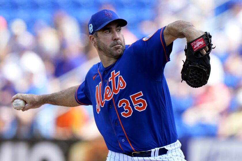 New York Mets starting pitcher Justin Verlander (35) throws during the first inning of a spring training baseball game against the Houston Astros, Friday, March 10, 2023, in Port St. Lucie, Fla. (AP Photo/Lynne Sladky)