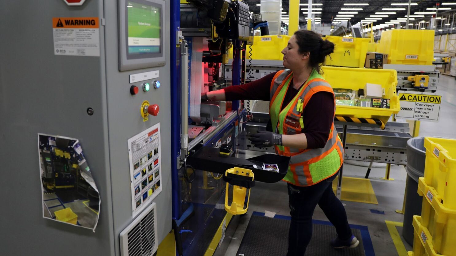 Column Amazon Is Defined By Billions But Its Workers Median Pay Is 28 446 Los Angeles Times