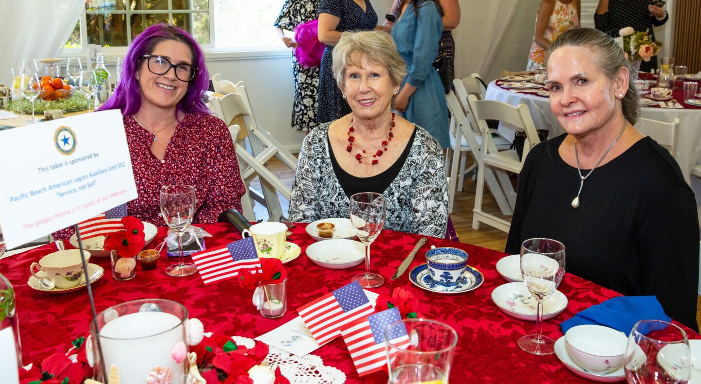 Dina Comstock, Maggie Frazier and Sandee Van Orshoven at the table sponsored by the Pacific Beach American Legion Auxiliary Unit 552.