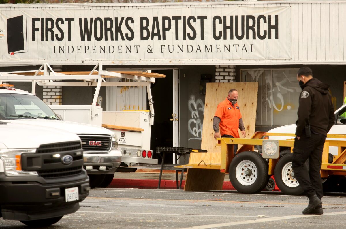  A worker cleans up after an explosion at First Works Baptist Church in El Monte.