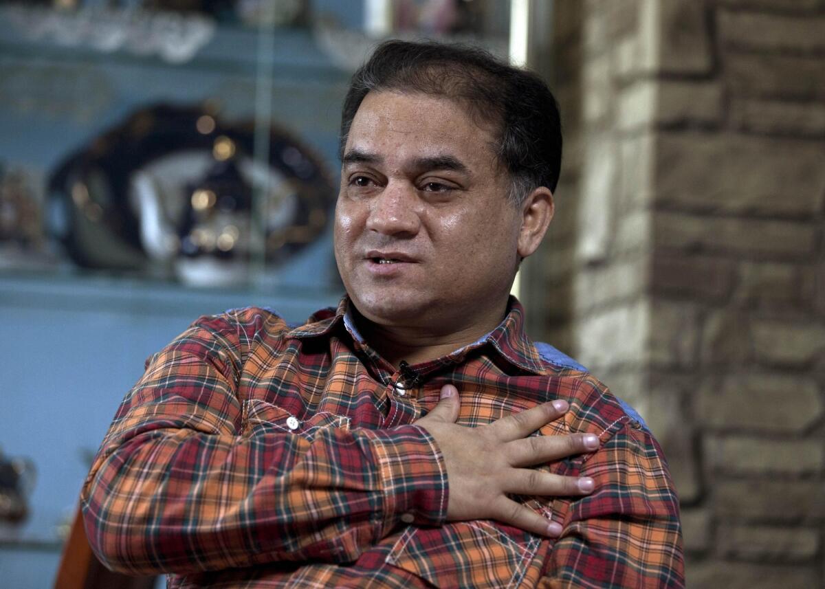 Ilham Tohti, an outspoken scholar of China's Uighur ethnic minority, is interviewed at his home in Beijing on Feb. 4, 2013.