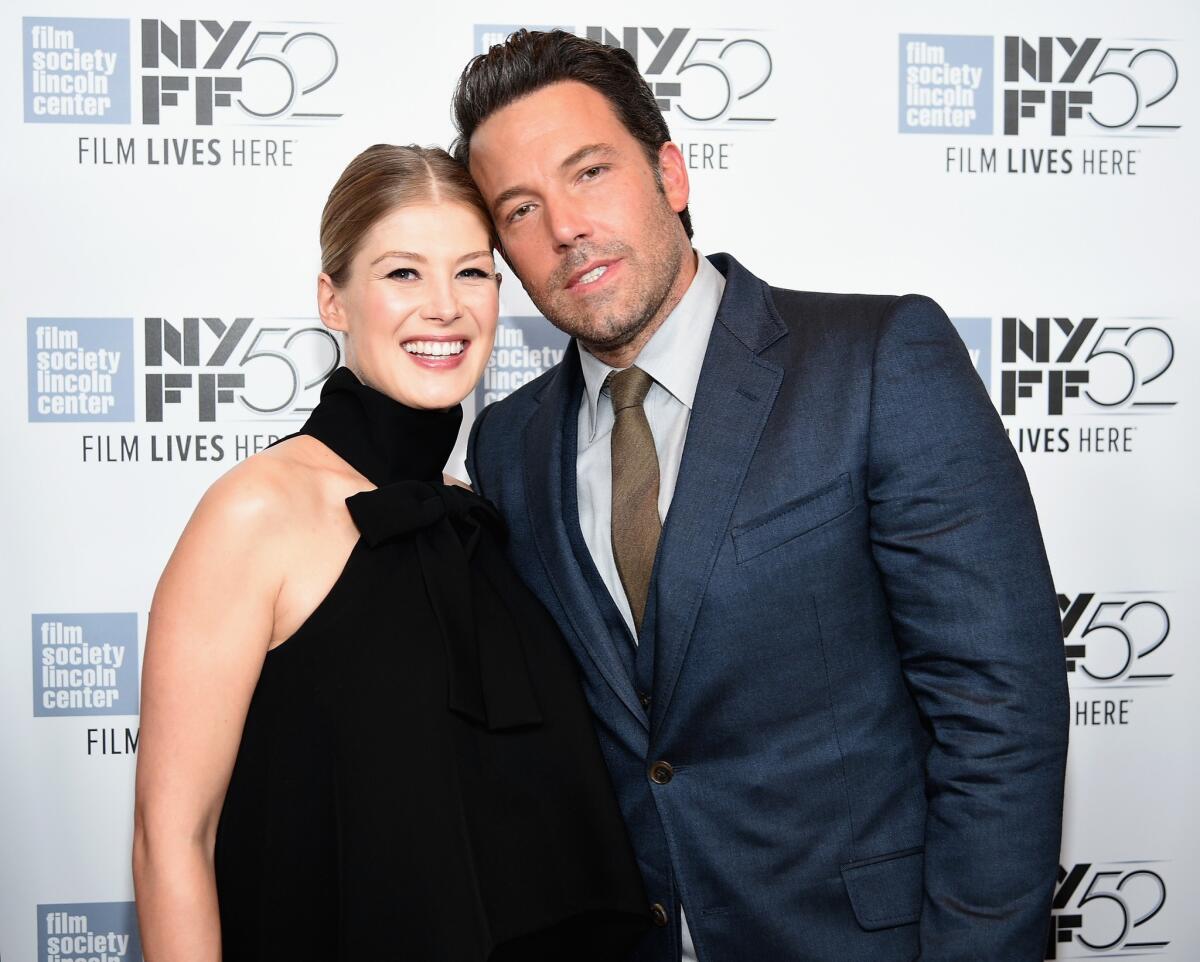 Actors Rosamund Pike and Ben Affleck attend the opening night presentation of 'Gone Girl' at the New York Film Festival.