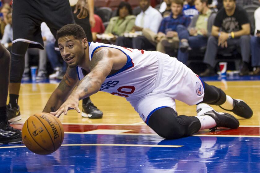 Royce White reaches for a loose ball during a 2013 preseason NBA game with the 76ers.