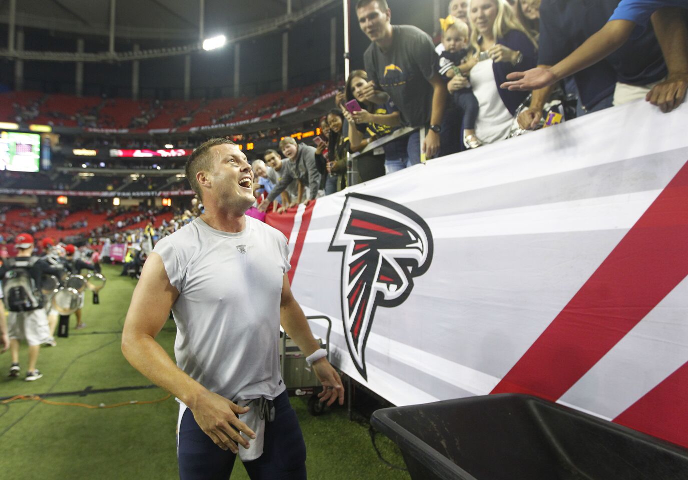 San Diego Chargers Philip Rivers celebrates with fans after a 33-30 overtime victory against the Falcons in Atlanta on Sunday, Oct. 23, 2016. Photo by K.C. Alfred/The San Diego Union-Tribune