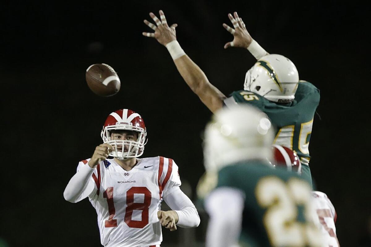 Mater Dei quarterback J.T. Daniels passes against Edison.