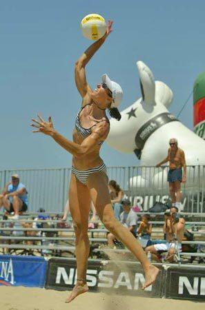 Elaine Youngs, teammate of Rachel Wacholder, serves against Michelle Morse and Stephanie Roberts during the AVP Hermosa Beach Open today at the Hermosa Beach Pier. Elaine Youngs and Rachel Wacholder defeated Michelle Morse and Stephanie Roberts 2-0.