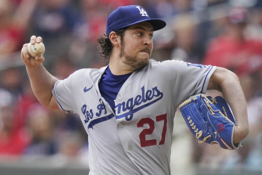 Los Angeles Dodgers starting pitcher Trevor Bauer (27) delivers in the first inning