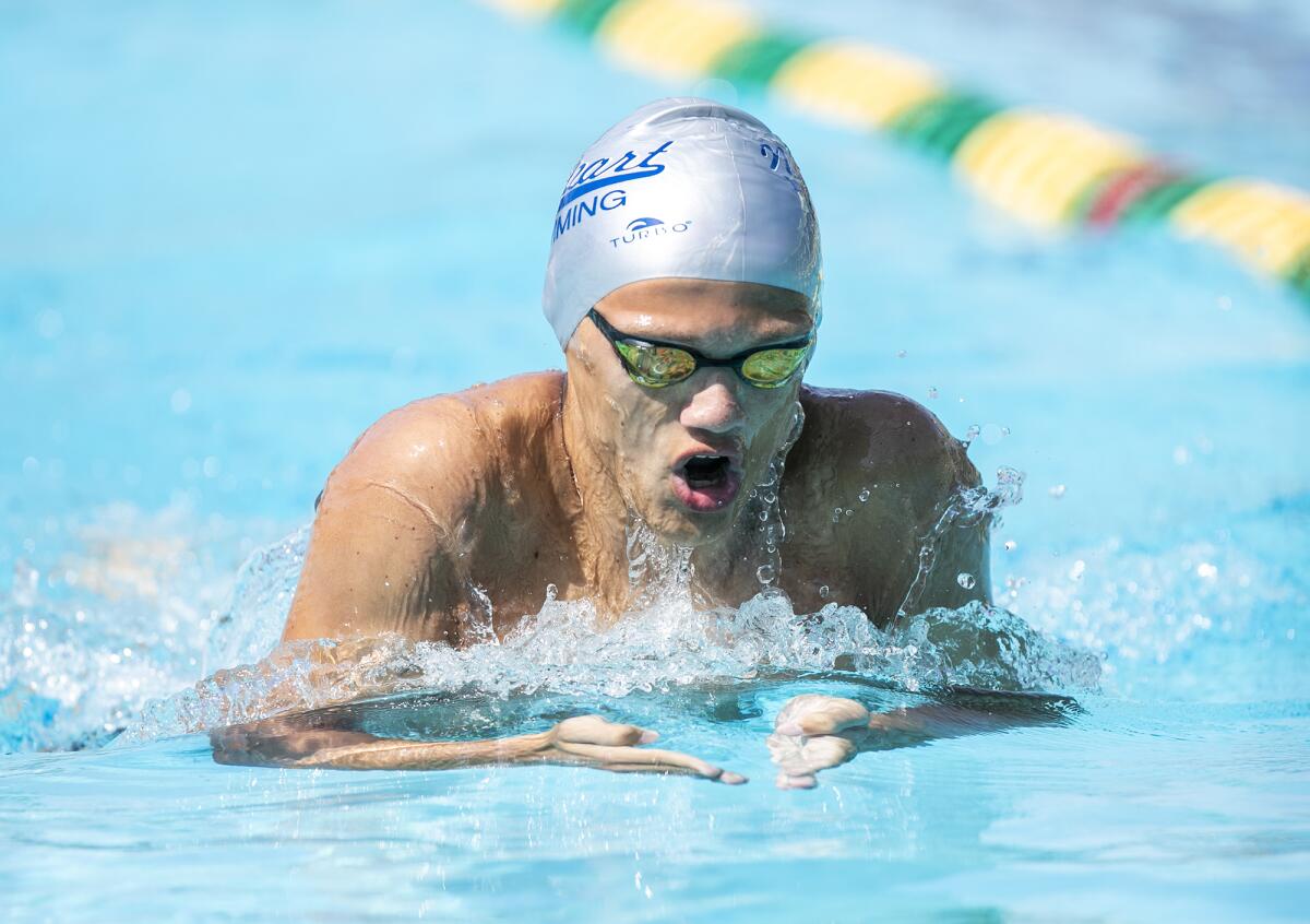 Newport Harbor's Bobby Wright swims the breaststroke in the boys' 200 IM during the Wave League swimming finals.