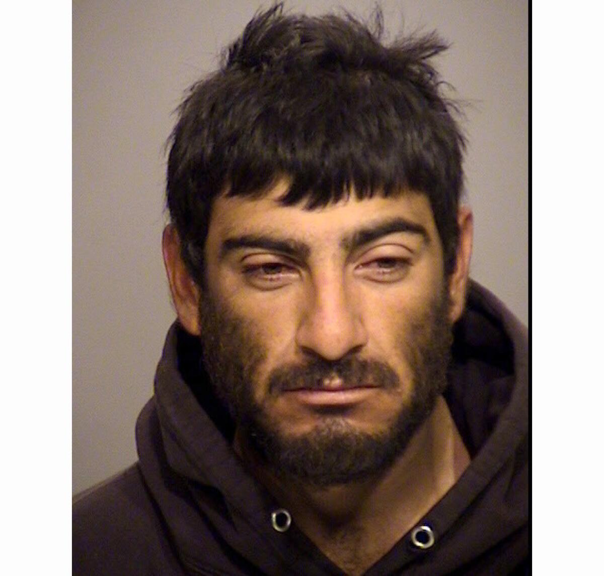 Jonathan Alfaro, shown in a booking photo, "walked off" from a Ventura detention facility, authorities say.