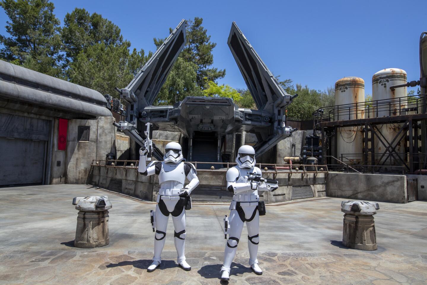 Storm Troopers patrol The First Order Outpost where the Tie Echelon fighter ship is parked as media members get a preview during the Star Wars: Galaxy's Edge Media Preview event at the Disneyland Resort in Anaheim, Calif., on May 29, 2019. (Allen J. Schaben / Los Angeles Times)