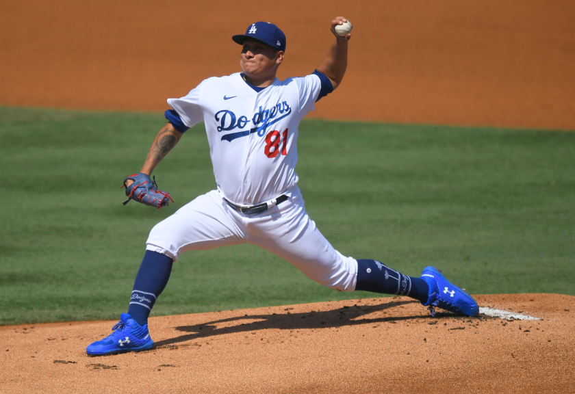Dodgers pitcher Victor Gonzalez delivers during the first inning against the Angels.