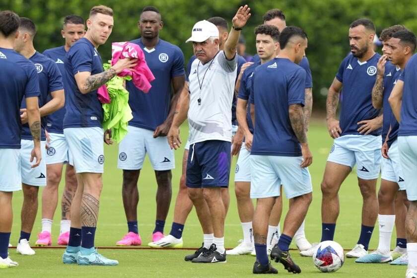 Cruz Azul head coach Ricardo Ferretti, center, works with players during practice for a Leagues Cup soccer match