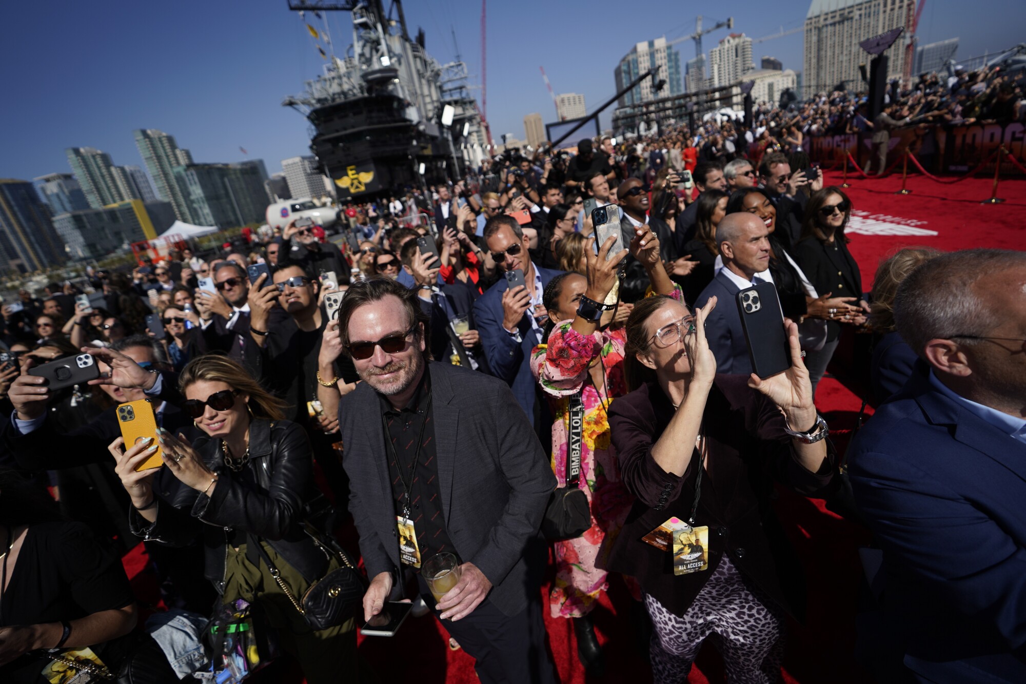 Cell phones aimed at the helicopter that flies Tom Cruise at the premiere.