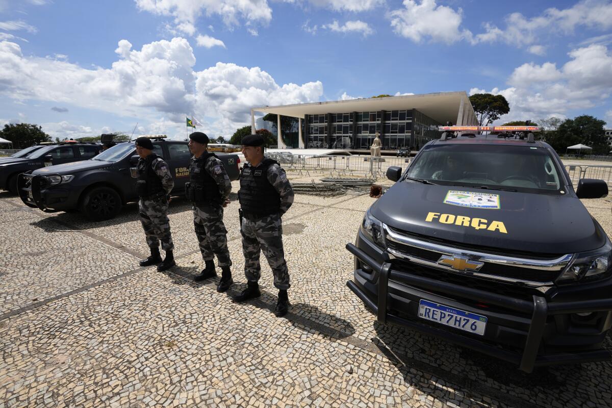 Military police stand guard outside the Supreme Court in Brasilia, Brazil, on Wednesday ahead of expected protests.