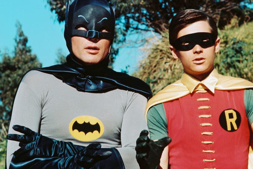 Adam West, left, stars as Bruce Wayne/Batman, and Burt Ward is Dick Grayson/Robin in the TV series "Batman" in 1966.