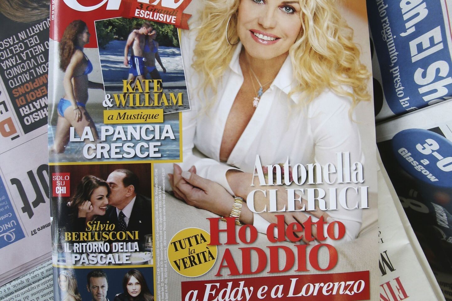 The cover of Italian magazine CHI hits the stands in Milan, Italy on Feb. 13, 2013. Royal officials in Britain expressed disappointment that paparazzi shots of Prince William and the Duchess of Cambridge strolling on a beach were published.