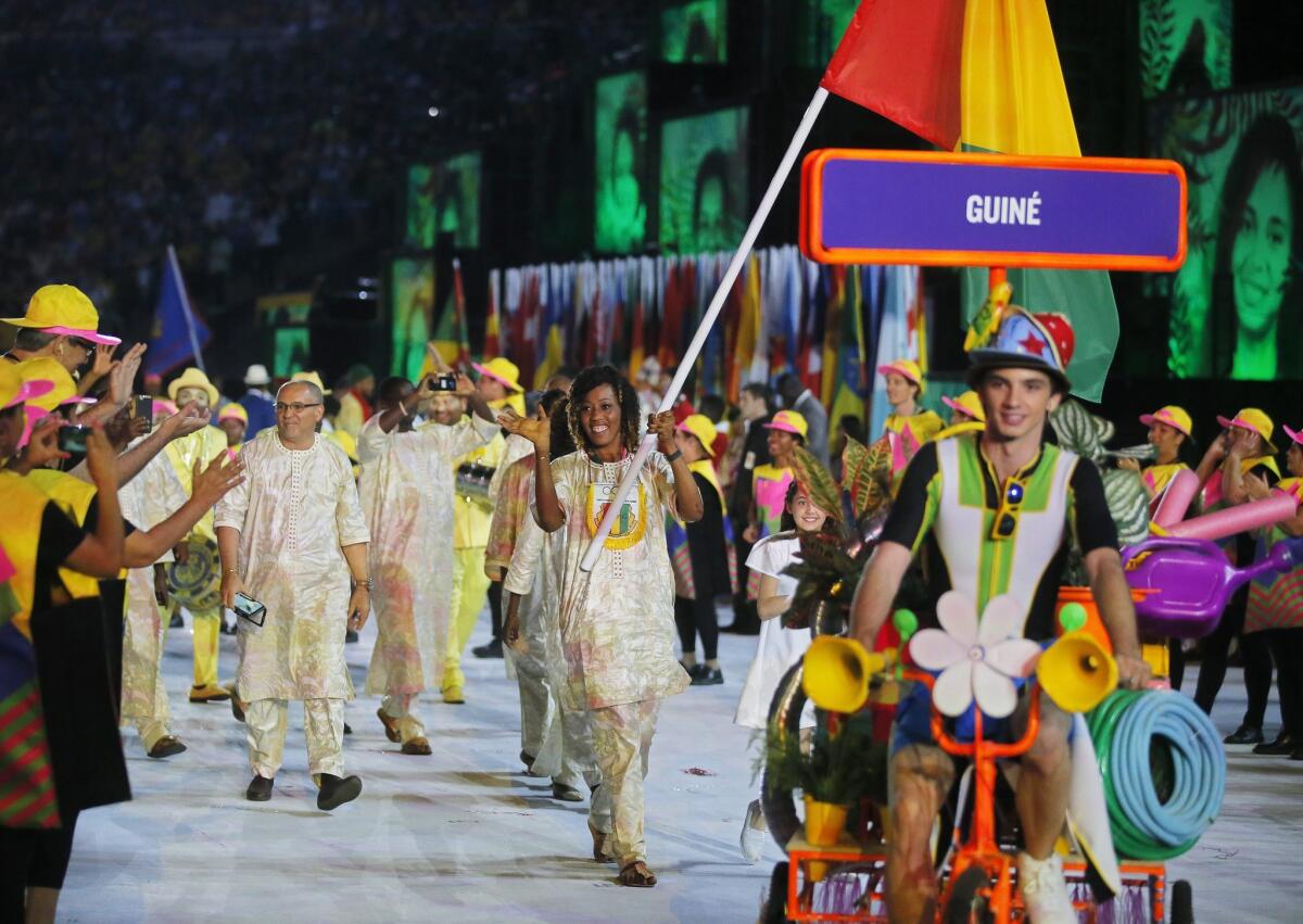 Mamadama Bangoura carries the flag of Guinea during the opening ceremony for the Rio Olympics on Aug. 5.