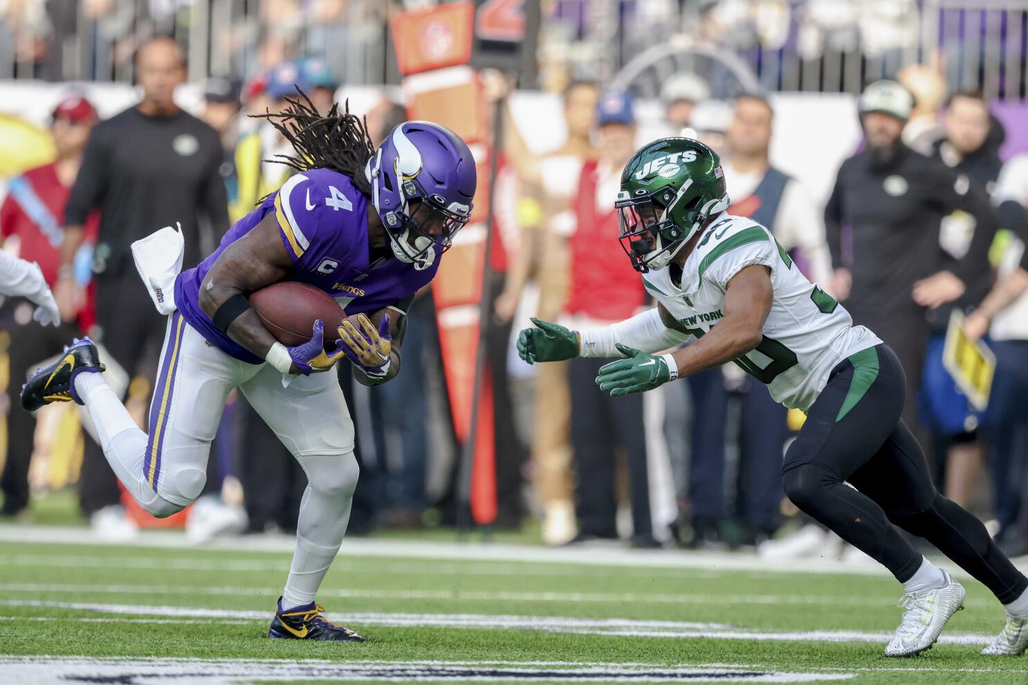 Minnesota Vikings running back Dalvin Cook walks on the field