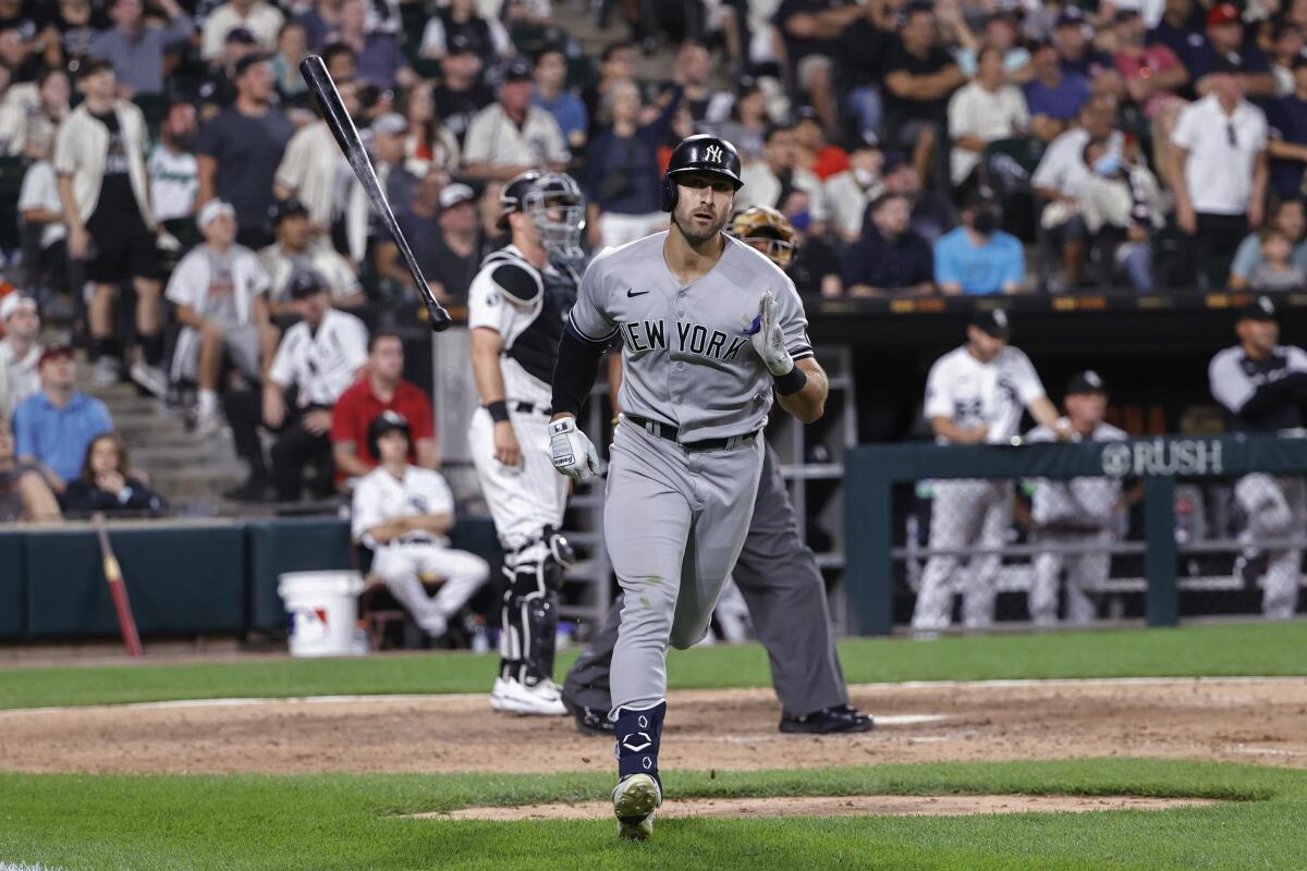 New York Yankees' Joey Gallo runs the bases after hitting a two-run home run off Chicago White Sox relief pitcher Liam Hendriks during the 10th inning of a baseball game Saturday, Aug. 14, 2021, in Chicago. (AP Photo/Kamil Krzaczynski)