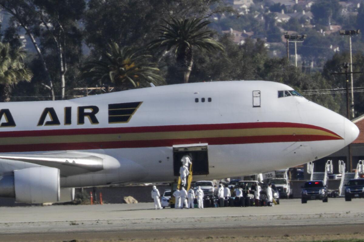 Airplane carrying U.S. evacuees from Wuhan, China, lands at Riverside air base
