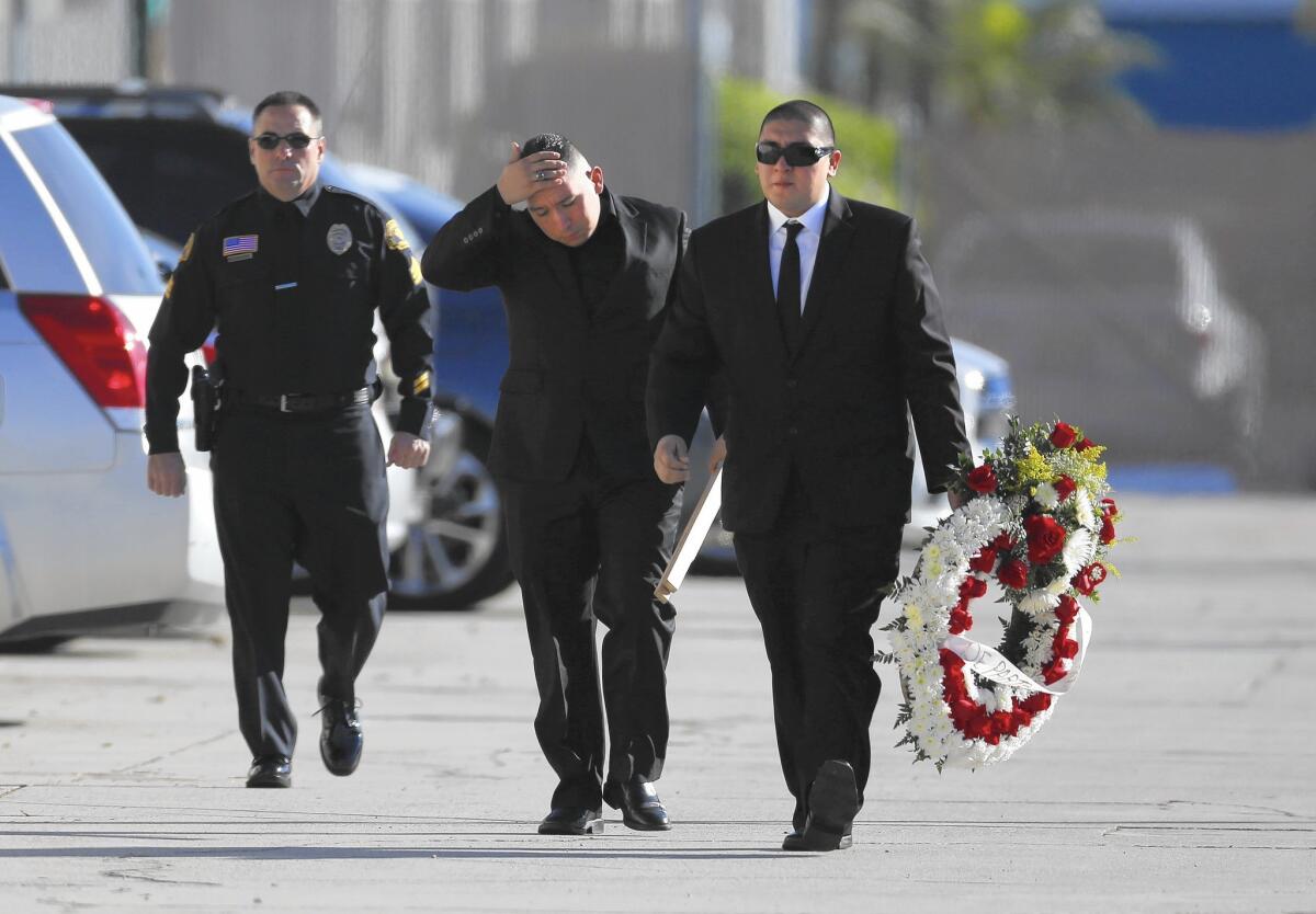 Family and friends arrive at Calvary Chapel South Bay in Gardena for the services for Aurora Godoy.