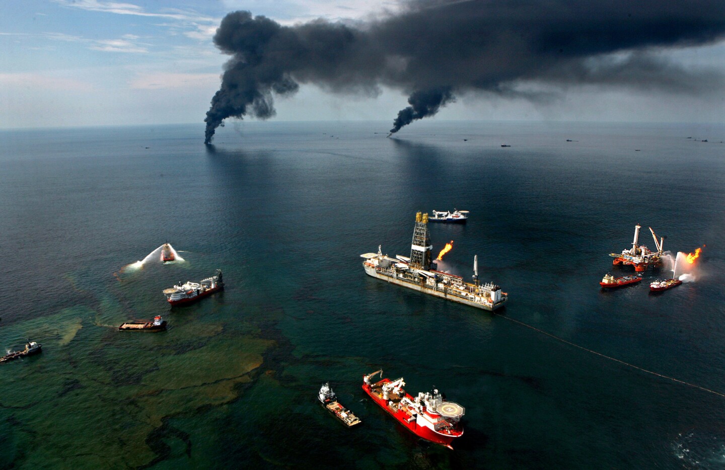 Fires burn around the BP Deepwater Horizon oil rig in the Gulf of Mexico in 2010. During the huge spill off the Louisiana coast, Subra joined with the Louisiana Environmental Action Network to prepare for oil reaching land.
