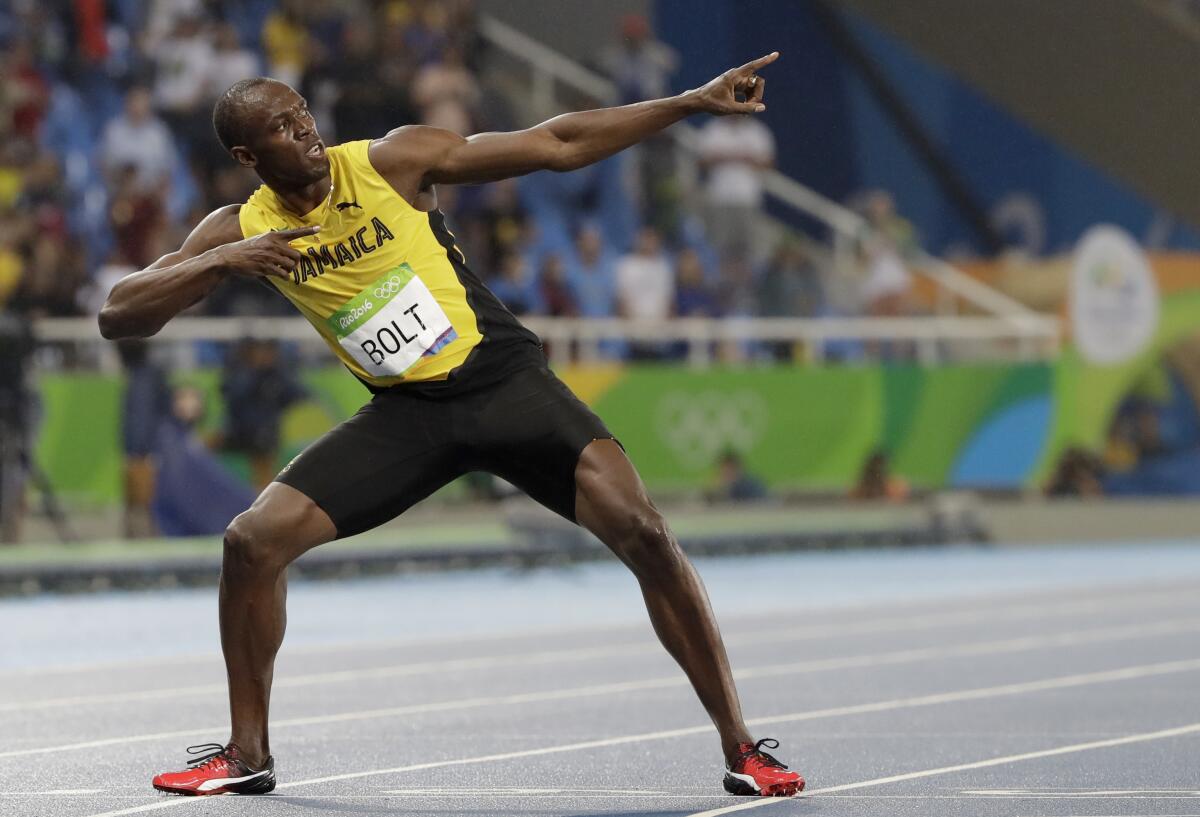 FILE - Usain Bolt from Jamaica celebrates winning the gold medal in the men's 200-meter final during the athletics competitions of the 2016 Summer Olympics at the Olympic stadium in Rio de Janeiro, Brazil, in this Thursday, Aug. 18, 2016, file photo. The retired world’s fastest man is not only changing diapers these days, but also distances as he makes a brief comeback for a promotional event. (AP Photo/David J. Phillip, File)