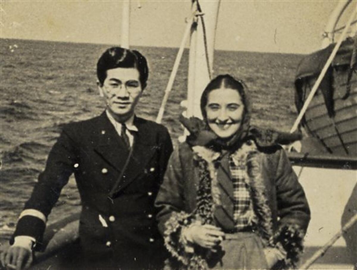 This undated photo found in a diary owned by Japanese tourism official Tatsuo Osako and released on July 26, 2010 by Akira Kitade who worked under Osako, shows Osako with a woman on a ship. The photo is part of a recently discovered group of prints which throws more light on a subplot of the Holocaust: the small army of Japanese bureaucrats who helped shepherd thousands of Jews to safety. (AP Photo/Tatsuo Osako) EDITORIAL USE ONLY- NO SALES