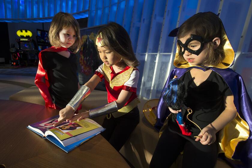 Among DC Super Hero Girls costumes are Batgirl, worn by Charlotte Osterloh, 6; Supergirl , worn by Elyse Osterloh, 4; and Wonder Woman, worn by Summer Taira, 7.