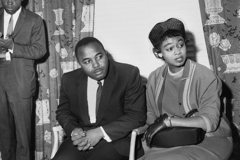 FILE - Christopher McNair, center left, and Maxine McNair, right, parents of Denise McNair, one of four African American girls who died in a church bombing in Birmingham, Ala., Sept. 15, hold a news conference at a hotel, Sept. 20, 1963, in New York. Maxine McNair, the last living parent of any of the children killed in the 1963 bombing of Birmingham's 16th Street Baptist Church, died Sunday, Jan. 2, 2022. She was 93. (AP Photo/File)