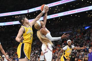 BOSTON, MA - AUGUST 20: Li Yueru #28 of the Los Angeles Sparks blocks the shot during the game against the Connecticut Sun on August 20, 2024 at TD Garden in Boston, Massachusetts. NOTE TO USER: User expressly acknowledges and agrees that, by downloading and or using this photograph, User is consenting to the terms and conditions of the Getty Images License Agreement. Mandatory Copyright Notice: Copyright 2024 NBAE (Photo by Brian Fluharty/NBAE via Getty Images)